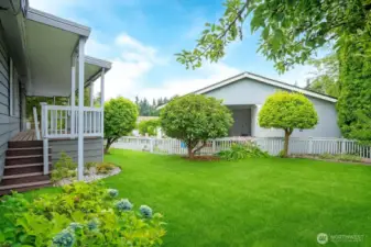 Large, fenced, and flat backyard.