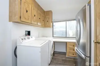 Utility room featuring additional cabinets and ample counter space.