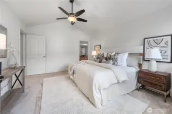 Beautiful primary suite with vaulted ceilings