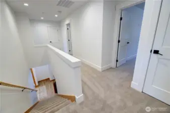 Upstairs is all carpet and white trim in both townhomes