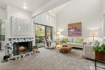 From the dining room looking towards the living room.  Note fireplace and slider to large outside deck