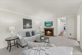 Spacious Living and Dining area with Fireplace and Large Windows to let in the Natural Light.