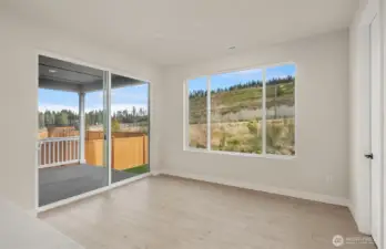 Dining to deck-Same design of home, but a different, sold one.