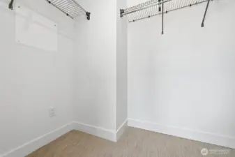 Walk in closet in the primary suite.