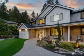 Walk by a fountain and landscape lighting on your way to the door.