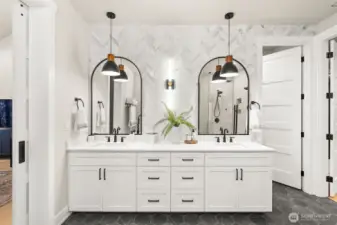 A marble mosaic wall for added elegance in the primary bathroom.