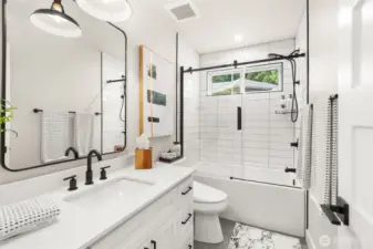 A secondary full bath serving one of the second floor bedrooms.