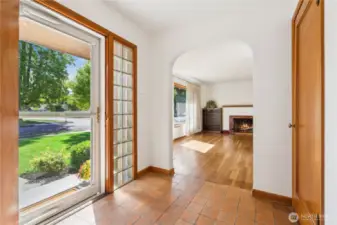 Terra Cotta tile entry greets your guest at the front door. Glass blocks on both sides of soild wood door allow light even on the darker days.