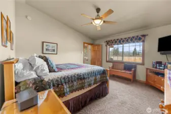 Primary bedroom with views to the backyard and beyond.