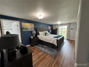Primary bedroom with sliding glass for to front deck