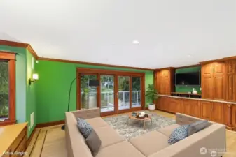 Childrens Wing Bonus/Recreation Room. Wall of Canyon Creek cabinets with wetbar, refreigerator, ample storage. White Tiger granite counters. Flat Screen TV stays.