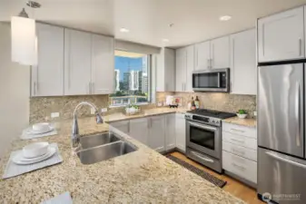 The Kitchen has Granite counters, stainless steel appliances and painted cabinets.