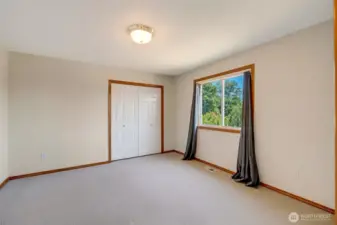 Main-Level Bedroom Featuring Closet and Direct Bathroom Entry