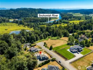 Aerial view showcasing the property’s stunning surroundings, with sweeping vistas of the Snohomish River and the natural beauty of the area.