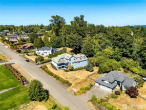 Spacious lot in a well-maintained neighborhood, with a private wooded area providing backyard seclusion.