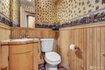 Half bath off kitchen in pantry area.