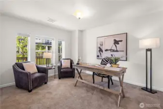 Currently furnished as an office, the downstairs bedroom includes its own en-suite bath.