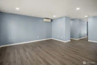 Open-concept layout with recessed lighting, new flooring, and neutral tones ready for your personal touch.