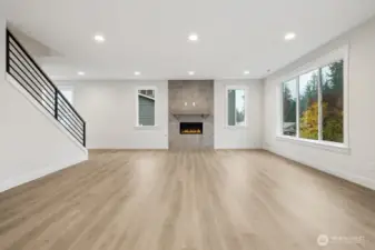 Fully tiled gas fireplace for cozy evenings.