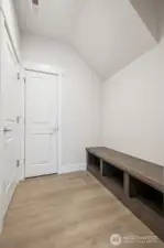 convenient "mud room" off of garage, and additional storage closet.