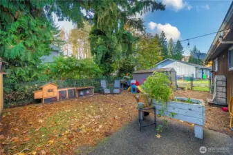 A generous fenced backyard provides room for pets to roam, little ones to explore, and endless outdoor living potential — plus convenient storage for tools and gear.