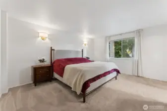 Upstairs primary bedroom, generous in size and on the opposite side of other bedrooms.