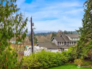 The Cascade range can be seen from the Primary Bedroom on a clear day.