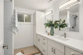 Freshly renovated and refreshed, the 2nd floor bathroom's double vanity offers plenty of space and storage.