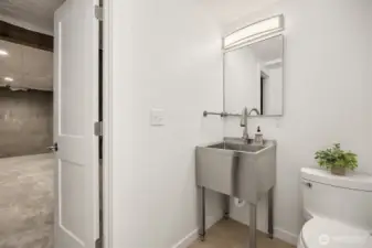The basement offers a renovated 1/2 bath with a practical utility sink.