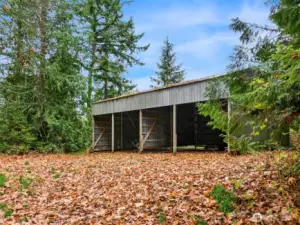 This large metal outbuilding provides dry storage for farm equipment, vehicles and/or outdoor items that require cover.