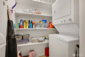 Utility room with storage shelves and in-unit w//d.
