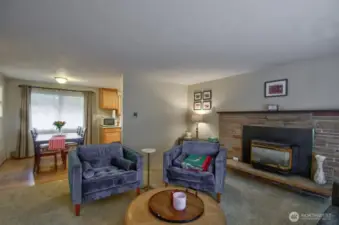 Spacious entertaining area with cozy propane insert that warms the whole house