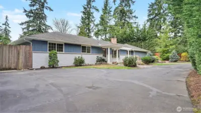 Great curb appeal with calming color palette and charming walk way surrounded by mature landscaping.