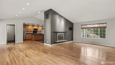 Spacious living room with cozy wood burning fireplace.