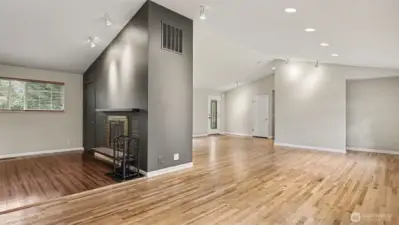 The spacious open floor plan effortlessly combines the living, dining, and kitchen areas—perfect for entertaining and everyday living.