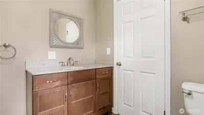 Half bathroom located off the kitchen