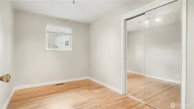 Third guest bedroom, also offering mirror closet doors.