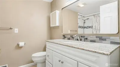 Full sized bathroom across from the guest bedrooms with plenty of counter space and storage.