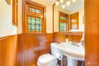 The main-floor powder room is tucked away for privacy.