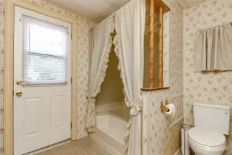 Primary Bathroom, and has access to the backyard.