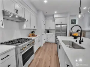 Dream kitchen boosts designated area for a coffee bar adjacent to the pantry. Photo is of model home-Victorian plan-elements of the Chateau plan can vary