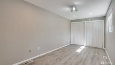 One of the three spacious guest bedrooms with double closets.