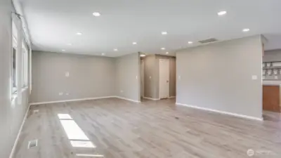 This great room flows seamlessly to other parts of the home with modern LVP floors flowing throughout.