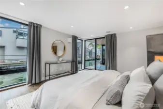 Primary suite offers two decks and luxe walk in closet.
