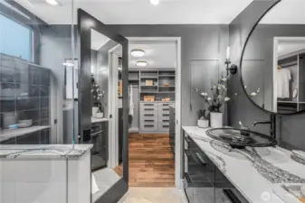 Newly painted and well appointed primary bath with electric heated flooring for an extra pop of comfort.