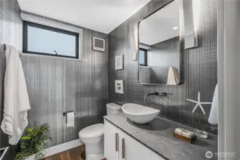Upper level half bath with radiant heated floors.