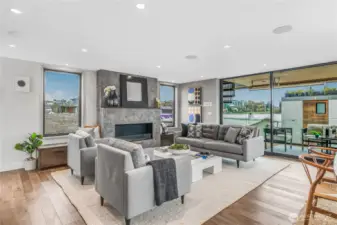 Thanks to the open floorplan, this space is perfect for entertaining or just relaxing and almost the entire front of the home opens up to the covered deck with heaters for four season living. Fireplace warms up entire house as well.