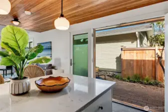 Folding glass doors open onto patio for outdoor dining/entertaining. Let the sun shine in!!