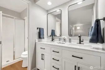 Shower and toilet are in a separate area w/door, perfect  for sharing the bathroom space.