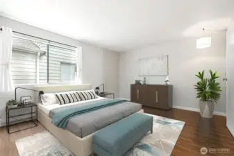 Virtually Staged! Primary Bedroom w/large window and attached 3/4 bath and walk in shower.